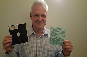Eddy Willems holding a diskette with the AIDS ransomware